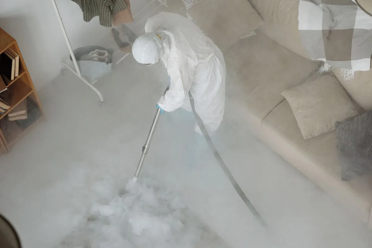 Biohazard cleanup technician in protective equipment, Marysville, MI